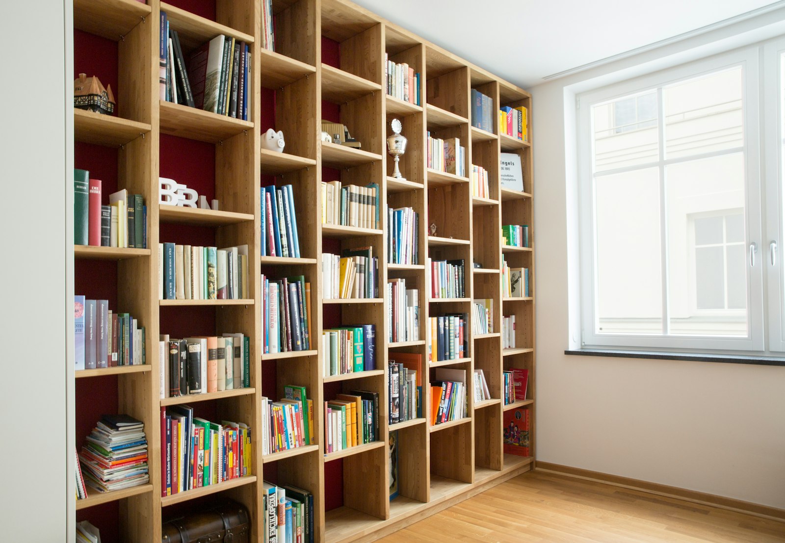 Floor-to-ceiling oak bookshelves