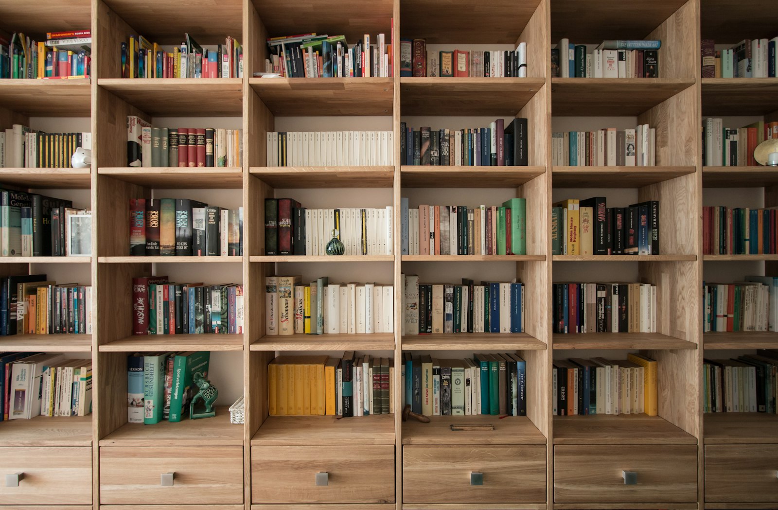 Oak built-in shelving with lower drawers