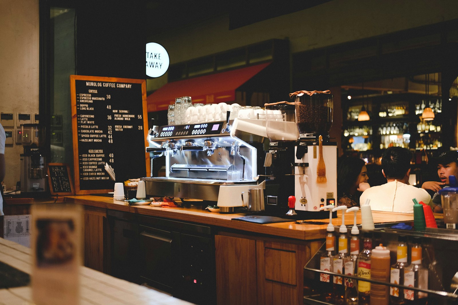 Restaurant bar with wood counter and shelving