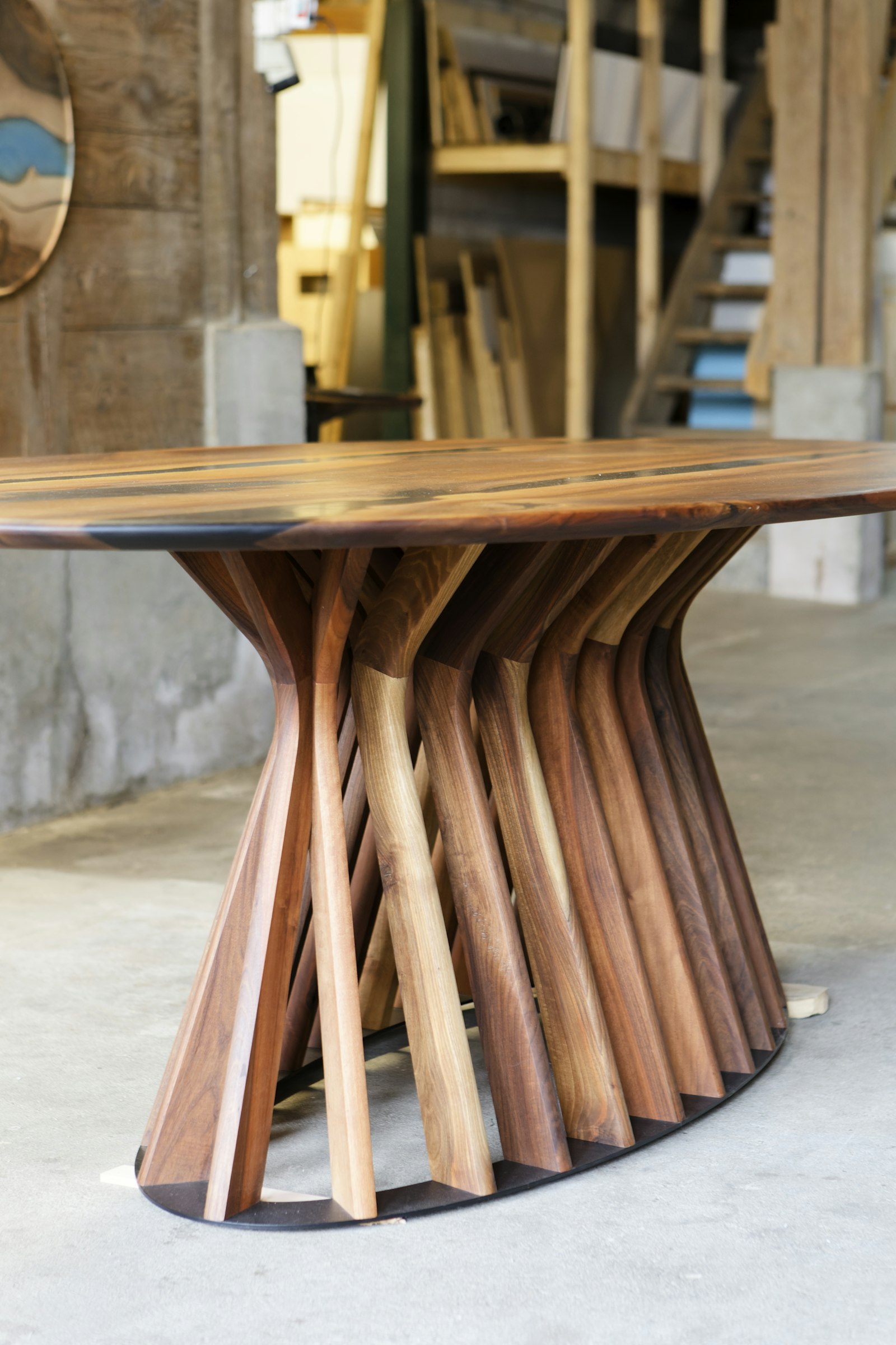 Sculptural live-edge walnut pedestal dining table
