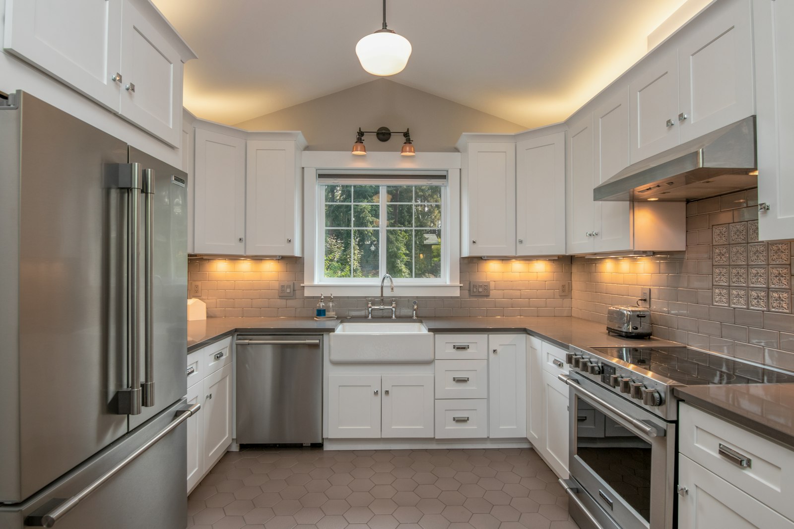 White cabinetry with farmhouse sink