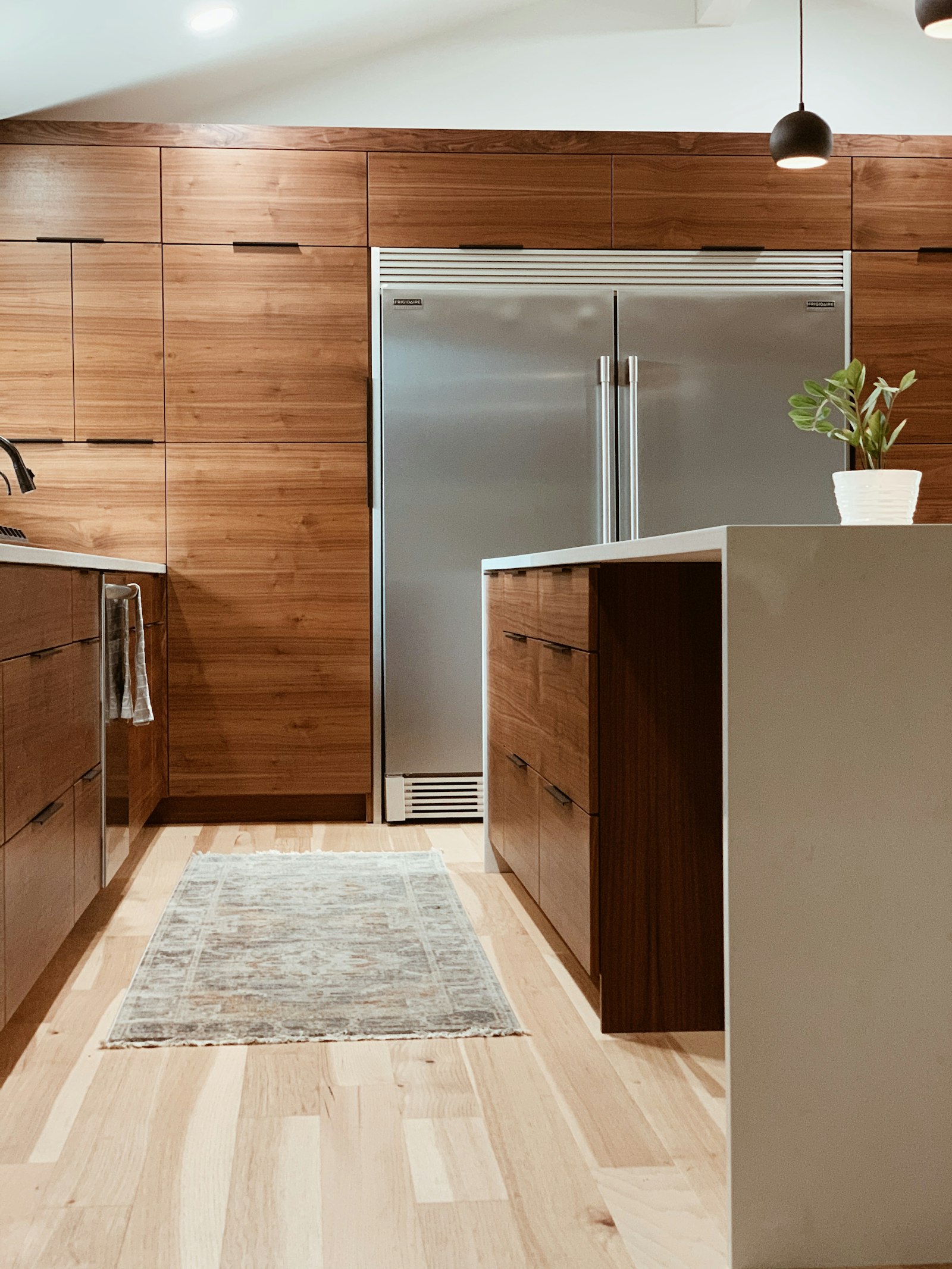 Modern walnut slab cabinetry kitchen