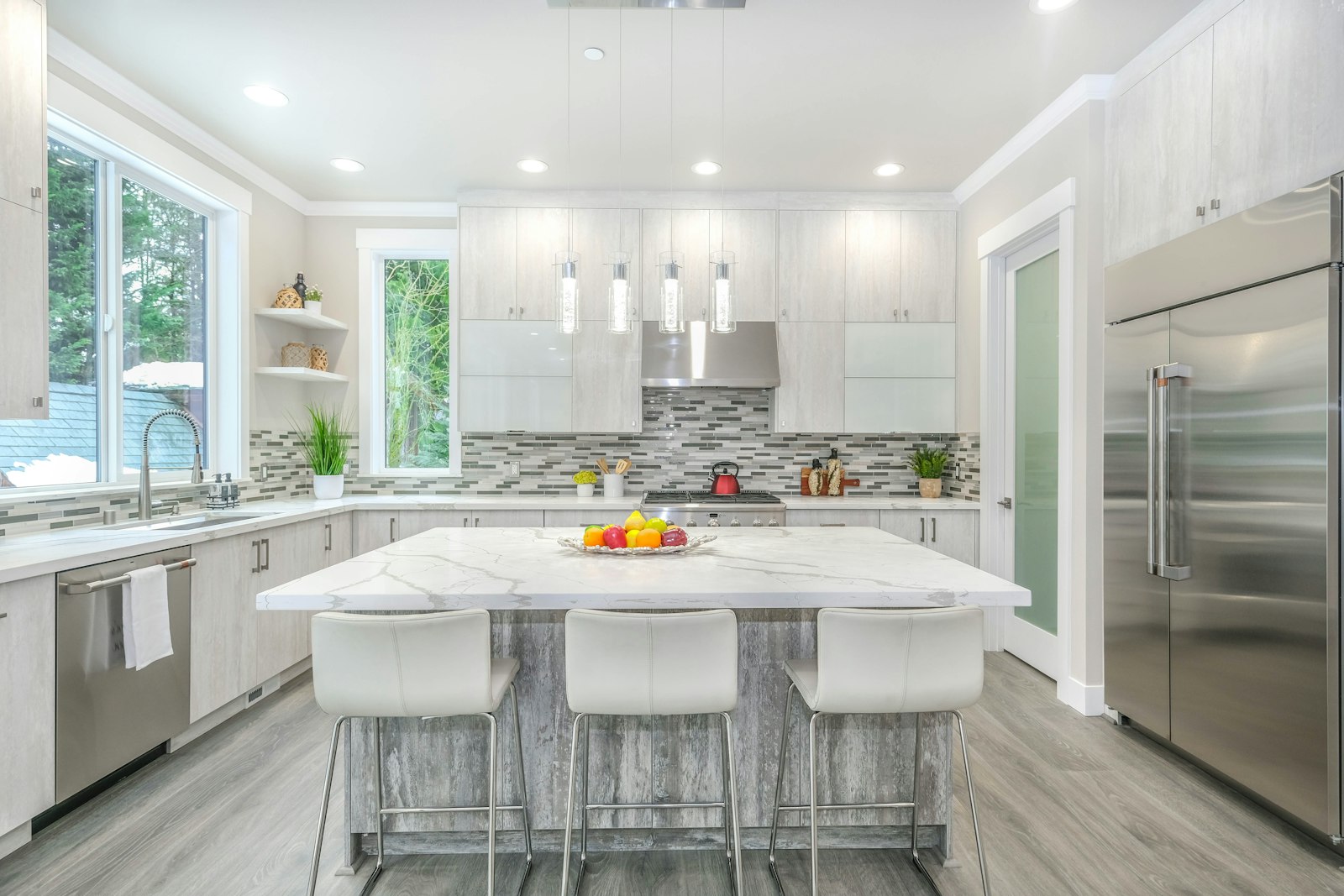 Bright white kitchen with island seating